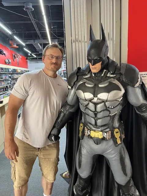 Patryk Golabek posing with Batman